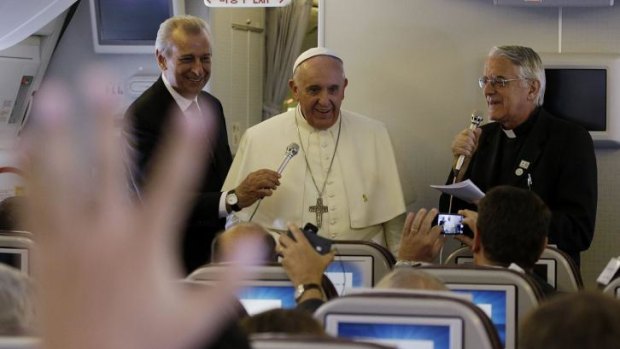 Pope Francis meets the media on the plane back to Rome from Seoul.