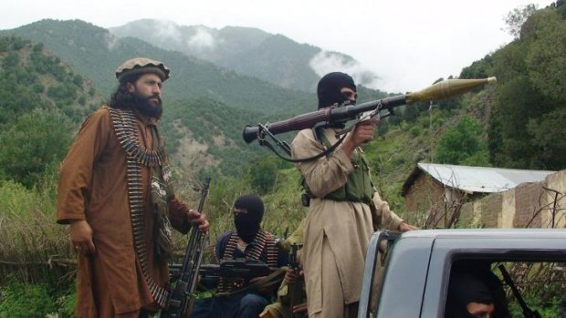 Pakistani Taliban patrol in their stronghold of Shawal in Pakistani tribal region of South Waziristan. The Taliban continue to threaten Malala and her family.