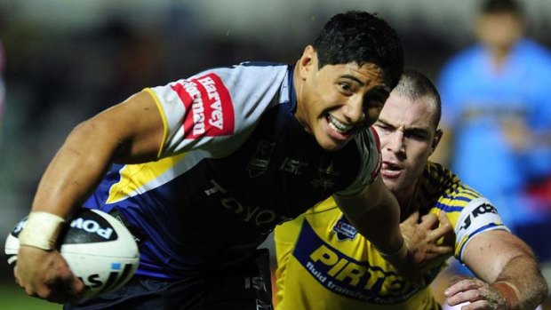 Rampage ... Young Cowboys forward Jason Taumalolo powers ahead during his sides 42-6 win over Parramatta last night.