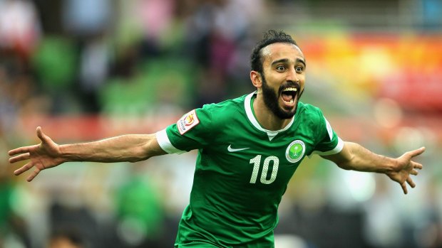 Mohammed Al Sahlawi of Saudi Arabia celebrates after scoring North Korea.