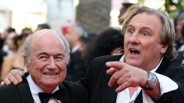 Gerard Depardieu (R) arrives at the Cannes Film Festival. 
