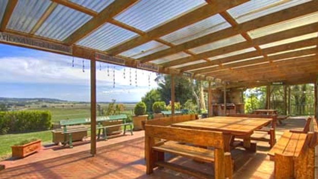 Purple patch ... Lavender Views homestead looks out over the valley and Cambewarra Range.