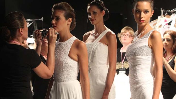 Fashion models pictured wearing Australian designer, Alex Perry showcasing his Couture Bridal Collection on the catwalk.