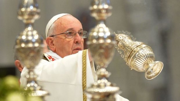The Pope leads a mass for Holy Thursday at St Peter's Basilica.