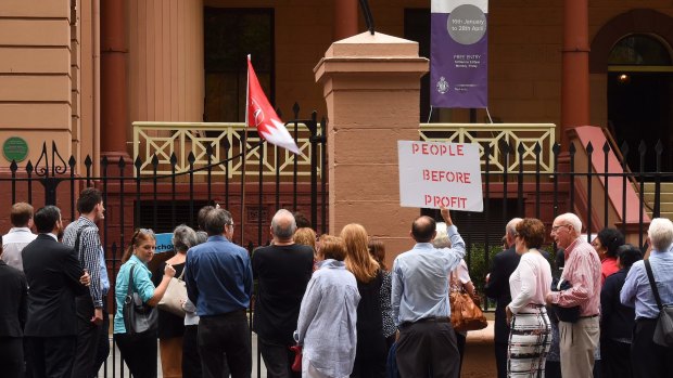 Protesters in front of NSW Parliament House demonstrating against the NSW government's privatisation of the land titles registry in the state.
