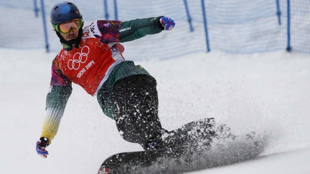 Chasing the dream: Alex Pullin competes in the men's snowboard cross quarter-finals at Rosa Khutor.