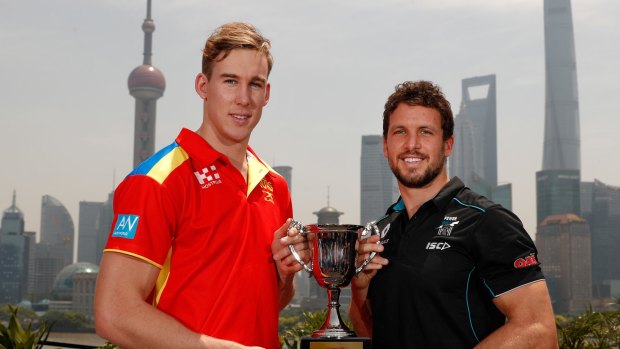 SHANGHAI, CHINA - MAY 11: Tom Lynch of the Suns (left) and Travis Boak of the Power pose for a photograph with the 2017 Shanghai Cup during the Port Adelaide Power and Gold Coast Suns joint Captain and Coach press conference at Bar Rouge overlooking The Bund on May 11, 2017 in Shanghai, China. (Photo by Michael Willson/AFL Media/Getty Images)