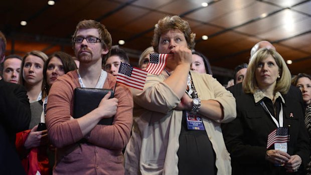 Beaten ... Mitt Romney supporters react on election night as President Barack Obama swept to re-election.