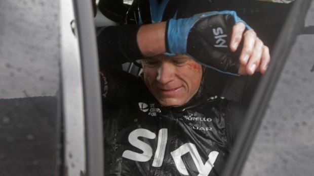 Abandoned: Chris Froome withdraws after suffering his third crash in two days.