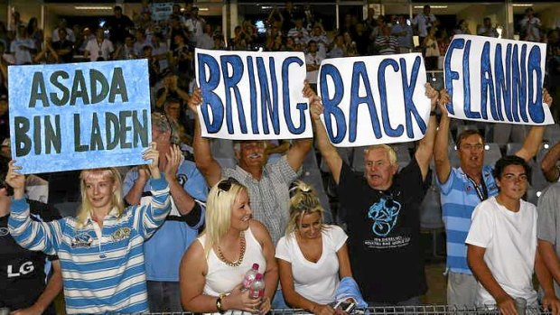 Sign of the times: Sharks supporters protest after the coach was an early casualty of the doping scandal that engulfed the club on the eve of the season.