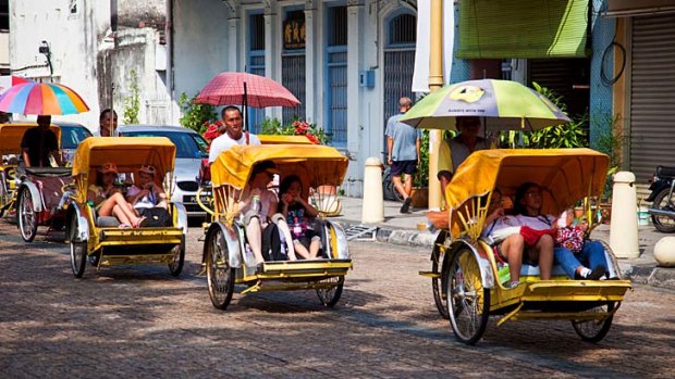 Roll-call ... trishaw passengers in Georgetown.