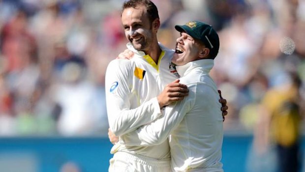 Come in spinner: Nathan Lyon and Dave Warner celebrate another wicket.