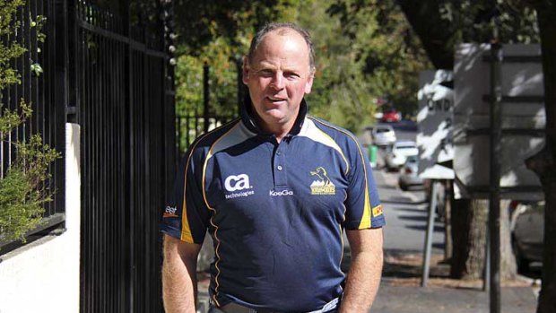 If the shirt fits ... South African Jake White wears his Brumbies outfit on the streets of Cape Town after being announced as the team's new coach for 2012.