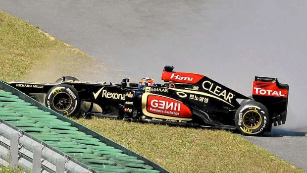 Lost control: Lotus driver Kimi Raikkonen of Finland crashes into the barrier during the first practice session of the  Korean Grand Prix.