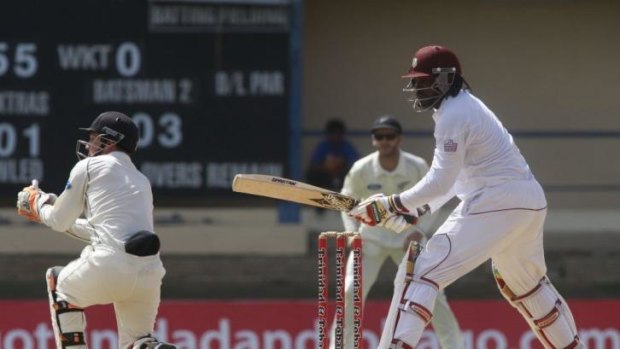 New Zealand's wicketkeeper BJ Watling with West Indies opening batsman Chris Gayle.