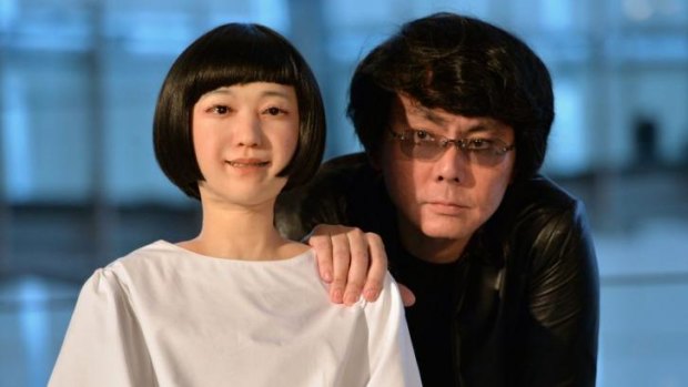 Osaka University professor Hiroshi Ishiguro (right) with his creation "Kodomoroid".