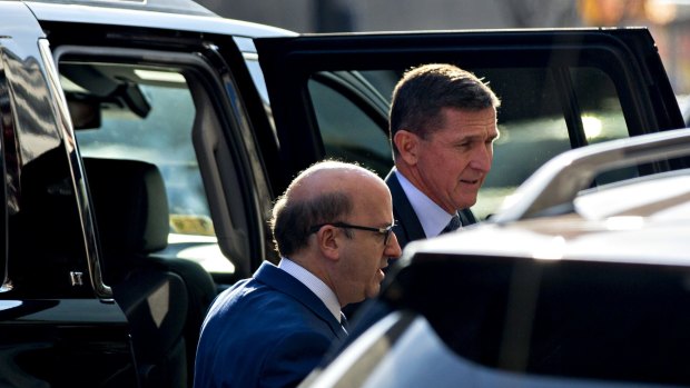 Michael Flynn, US national security advisor, right, exits a vehicle outside the US Courthouse in Washington, DC.