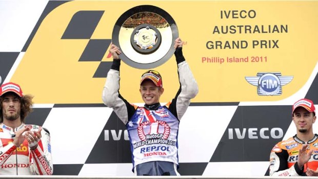 Casey Stoner, centre, claimed his second MotoGP championship on his 26th birthday at Phillip Island.