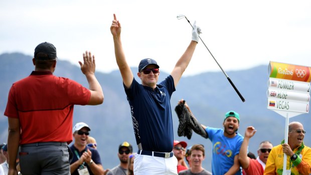 Olympic champion: Fans get behind British golfer Justin Rose after his historic hole-in-one during the first round in Rio