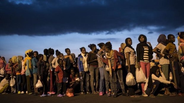 Human cargo: Hundreds of migrants from sub-Saharan Africa arrive in Sicily in September.