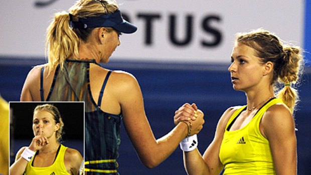Sharapova congratulates her conqueror Kirilenko. Inset: Quiet please: Maria Kirilenko is not talking it up yet.