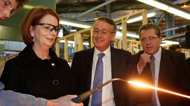 Just minding his own business ... Jordan O'Brien explains the blowtorch to Julia Gillard, Wayne Swan and the Minister for Skills, Chris Evans.