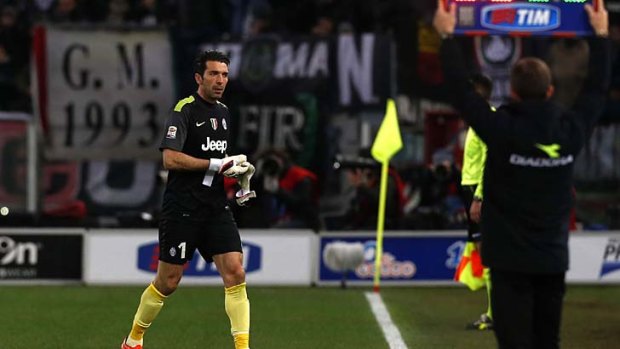 Juventus goalkeeper Gianluigi Buffon leaves the field after receiving a red card.