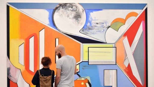 People look at an artwork by German artist Thomas Scheibitz entitled <i>Studio</I>.