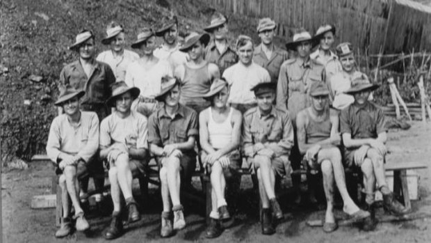 Story of survival … Arch Flanagan (back row, second from right, in cap) with other Australian POWs soon after the Japanese surrender in 1945.