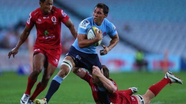 Phipps and starts: Nick Phipps takes on the Queensland Reds defence.