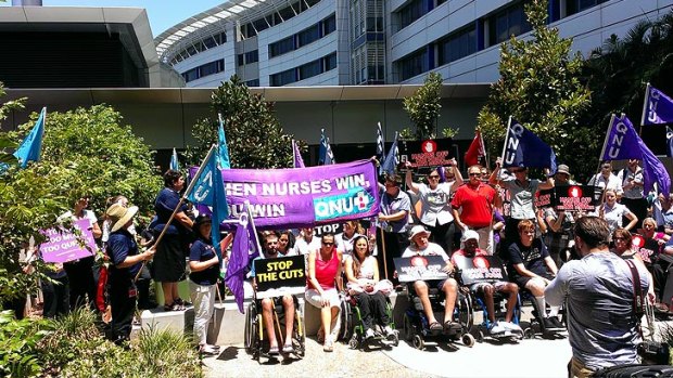Nurses rally outside the Princess Alexandra Hospital over job cuts.