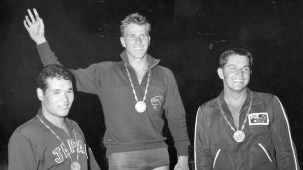 Champion ... Murray Rose after retaining the 400 metres freestyle title in Rome flanked by Tsuyoshi Yamanaka of Japan and John Konrads of Australia.