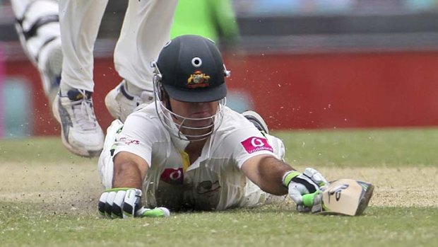 Close call: Ricky Ponting dives to make his ground to bring up his century.