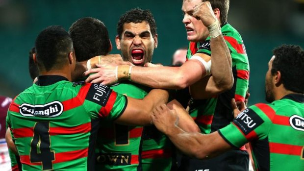 Greg Inglis and the Rabbitohs celebrate a big victory.