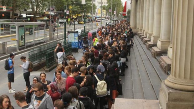 The queue snakes down Elizabeth Street prior to the official opening of H&M in Melbourne.