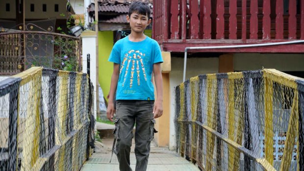 Afghan refugee boy Omid Jafary, 12, near his accommodation in Cisarua, Bogor, Indonesia.