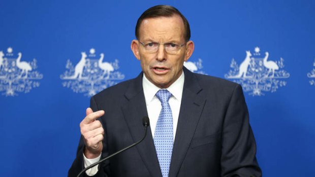 Prime Minister Tony Abbott addresses the media on Malaysia Airlines flight MH17 during a press conference at Parliament House in Canberra on Saturday.