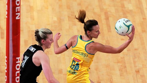 Close-run thing ... Australia's Natalie Medhurst secures the ball from Silver Ferns' defender Katrina Grant in Melbourne.