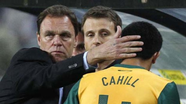 Australia's coach Holger Osieck greets Tim Cahill.