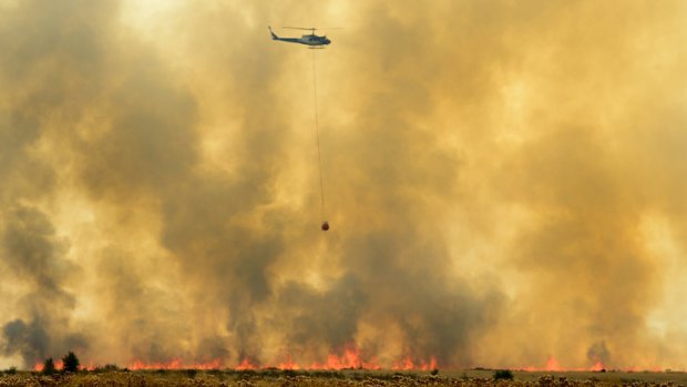 Relief from above... Choppers help combat the fires.