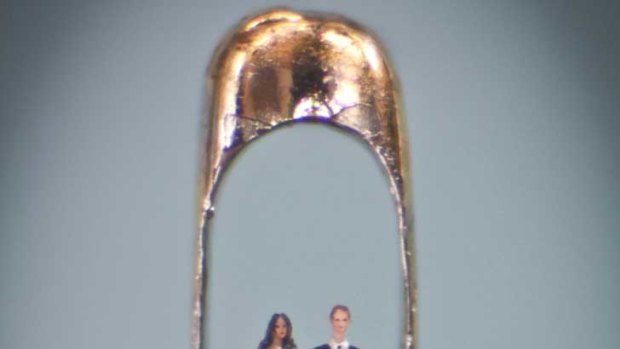 Micro-sculpture artist Willard Wigan's work  showing Prince William and Kate Middleton in an eye of a needle.
