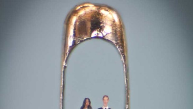 Micro-sculpture artist Willard Wigan's work  showing Prince William and Kate Middleton in an eye of a needle.