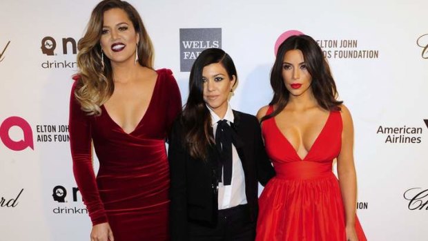 The odd one out: Khloe Kardashian, left, with sisters Kourtney and Kim.