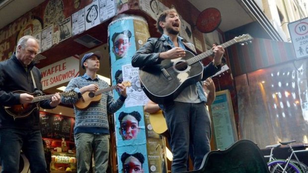 Musicians from the musical <i>Once</i> busk at Degraves Lane: (left to Right) Greg Stone, Keegan Joyce and Tom Parsons.