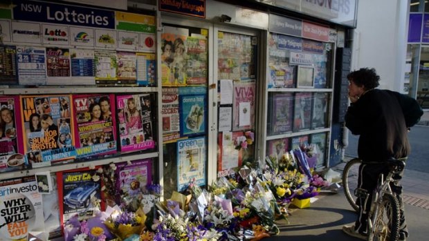 Tributes left at the newsagency.