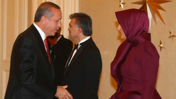 Tayyip Erdogan, left, greets Abdullah and Hayrunnisa Gul.