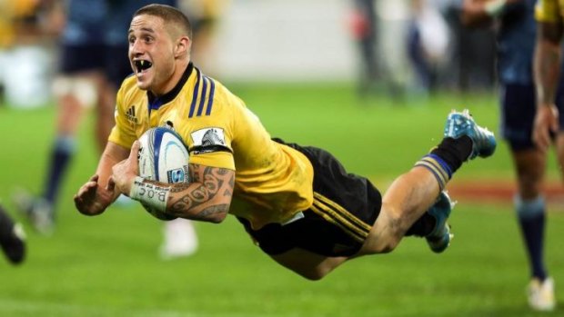 TJ Perenara scores a try for the Hurricanes during the round 10 Super Rugby match against the Blues at Westpac Stadium.