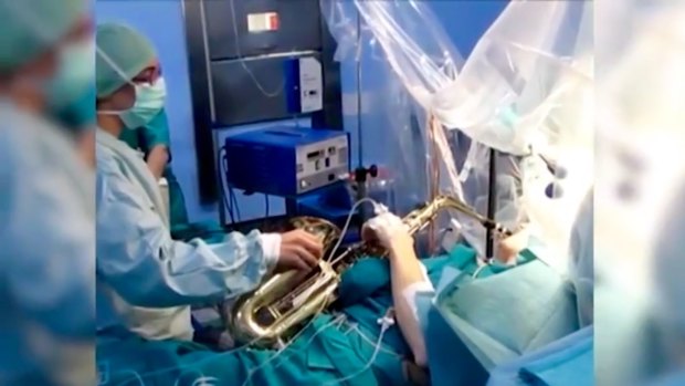 Spaniard Carlos Aguilera played his saxophone during a 12 hour brain surgery operation.