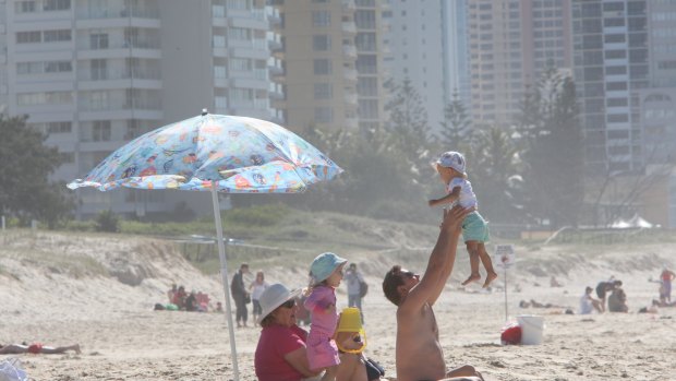 SURFERS PARADISE  080721 AFR PICTURE BY PETER BRAIG /   Generic pic. Gold Coast, surfers, families, babies, children,  queensland, australia., people walking on the beach , AFR FIRST USE ONLY. SPECIALX 210708 SPECIALX 210708