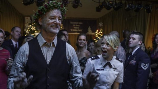 Captain Ng (Emma Stone) dances with Carson Welch (Bill Murray) in Aloha.